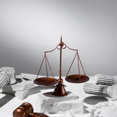 Scales of justice with gavel on law desk
